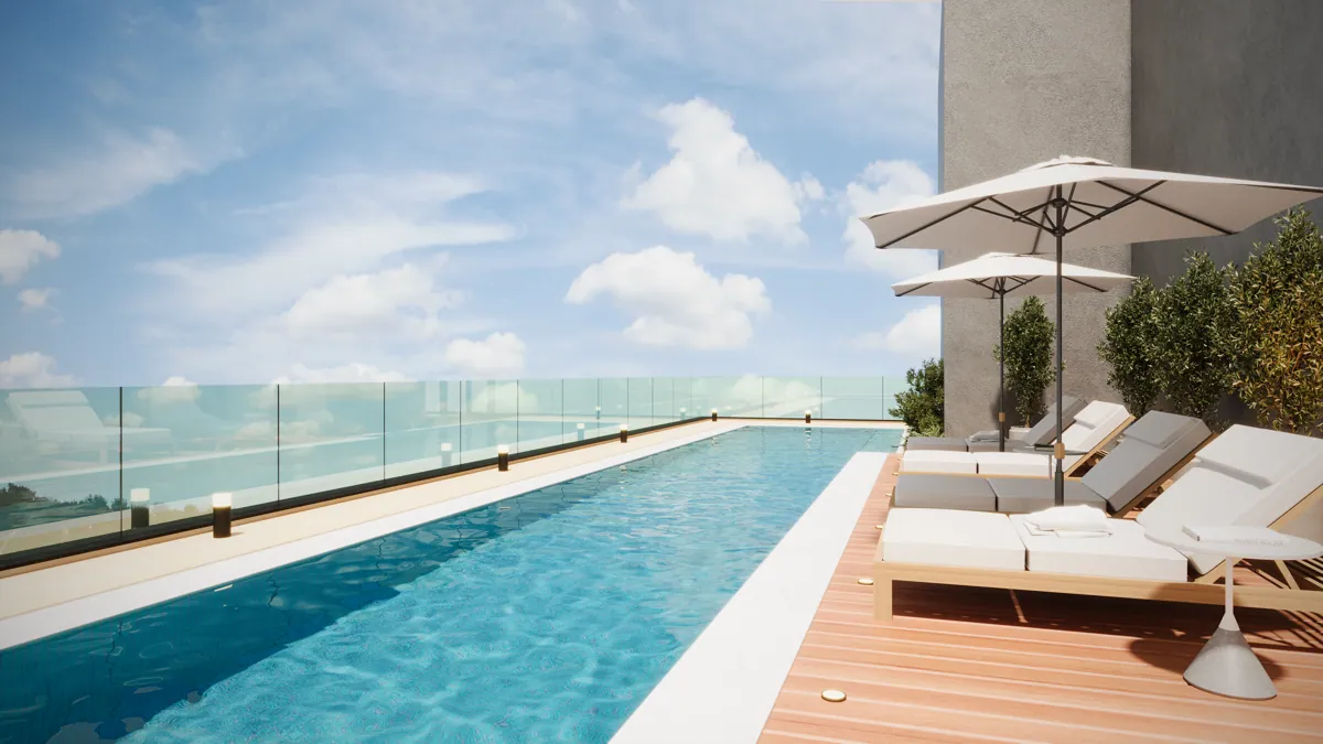 Rooftop com piscina e vista da cidade no Ateliê Vila Madalena